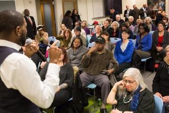 The Manhattan town hall drew a standing-room-only crowd.