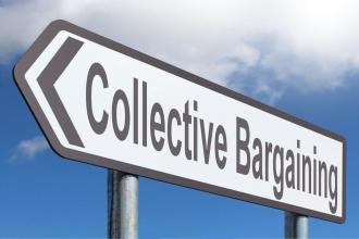 Street sign arrow that says collective bargaining