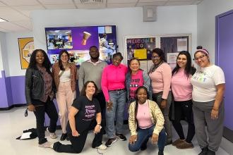 Members at Brownsville Academy High School in Brooklyn pose for a group photo. 