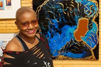 Angela Denise shows off her piece titled "Regal Beauty" at the New York City Art Teachers Association/UFT’s Dreams Art Show on May 10, 2024.
