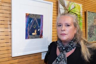 Kirsten Rorke of PS 373 at IS 61 on Staten Island takes a photo with her art piece at the New York City Art Teachers Association/UFT’s Dreams Art Show on May 10, 2024. 