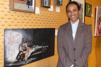 Nicole Weddle-Delon of IS 281 in Brooklyn shows off her artwork at the New York City Art Teachers Association/UFT’s Dreams Art Show on May 10, 2024.