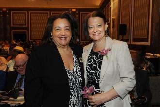 Two women pose for a photo at the 2024 UFT Retired Teachers Chapter Luncheon