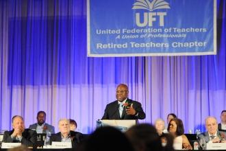 UFT Secretary LeRoy Barr addresses attendees at the 2024 UFT Retired Teachers Chapter Luncheon