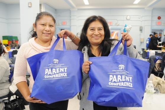 Attendees at the Staten Island Family Partnership Summit show off their UFT swag. 