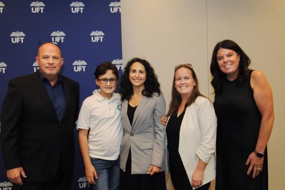 A group photo after a press conference for December 23 being an off-day for schools.