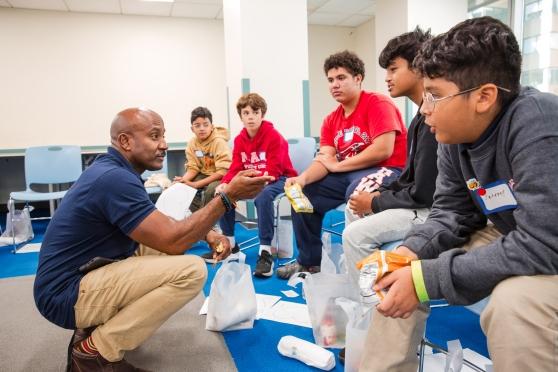 A dean speaks with students at the UFT Middle School Division's Anti-Bullying Conference on Oct. 24, 2024