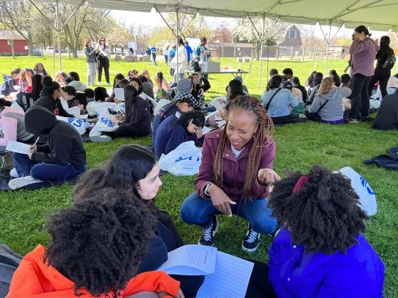 Kanika Mobley from MindUp talks with students in attendance at the UFT Member Assistance Program's 4th Annual Let's Talk About It event on April 16, 2024.